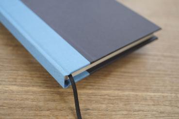 Writing and notebook black, with light blue linen